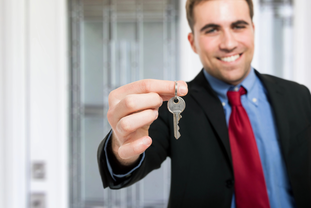 NTX Eviction expert handing keys to a Dallas-Fort Worth landlord after successful eviction