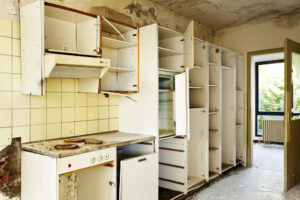 Damaged kitchen after eviction of squatter in Dallas Texas