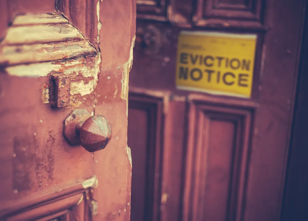 Posting eviction notice of front door for squatters in Dallas Texas