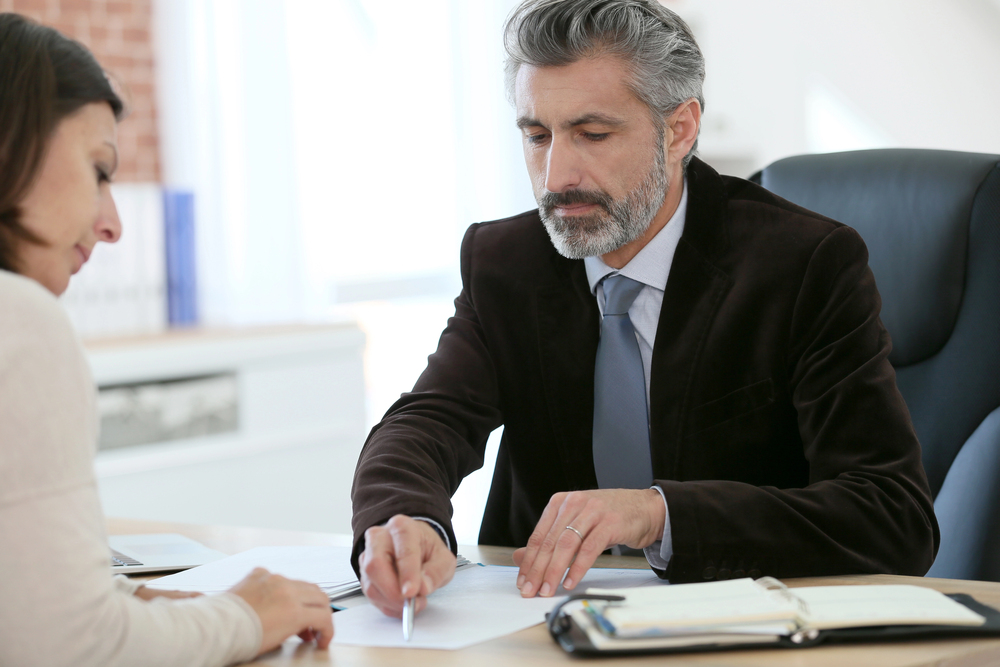 Landlord discussing eviction notice services with a professional in Dallas