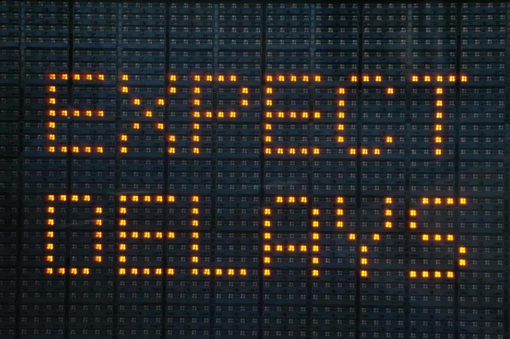 Sign display a message to expect delays